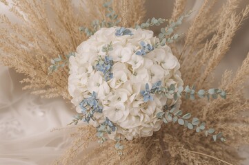Wall Mural - Elegant blue and white bridal bouquet featuring eucalyptus foliage