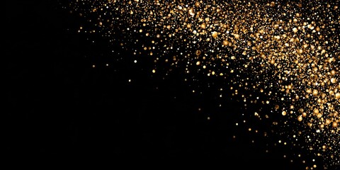 Golden glitter dust falling on black background particles