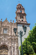 Church architecture in the state of Guanajuato, Mexico, with trees and public lighting on the side