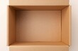 © TheWaterMeloonProjec - Close-up of a brown corrugated box on a plain white surface