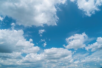 Wall Mural - Clear azure sky dotted with fluffy white clouds