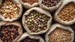 © Emin - Nutritious grains and dried fruits in small pouches. Overhead close-up of assorted dry beans and legumes. Various natural seeds and pulses.