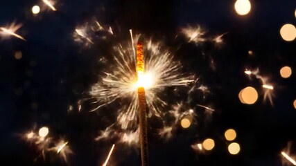 Wall Mural - A bright sparkler lit up in the darkness, perfect for nighttime or holiday scenes