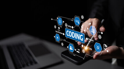 A developer utilizes a smartphone to visualize coding elements, showcasing interaction between technology and creativity in a modern workspace setting. Tessel