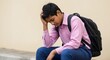© Chetanraj - Sad Indian schoolboy sitting with backpack, looking stressed and upset after school, symbolizing student pressure, exam stress, academic challenges, and emotional struggles