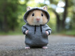 © 달지은 - Cute Hamster in a Gray Hoodie Standing Outdoors, 야외에서 회색 후드티를 입고 서 있는 귀여운 햄스터