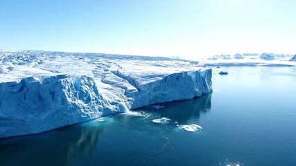 Wall Mural - Dramatic timelapse showing arctic ice slowly melting into pristine clear water under a vast sky outdoors, glacier, documentary