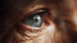 © Thares2020 - Extreme close up of an elderly human eye showing intricate detail of the iris and surrounding skin