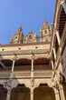 Salamanca University with its historic facade and ornate Plateresque architecture under a bright sky in Salamanca, Spain