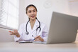 © SOMKID - Medical professional using a computer for online patient support, Medical professional and Healthcare technology Concept.