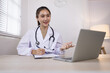 © SOMKID - Medical professional using a computer for online patient support, Medical professional and Healthcare technology Concept.