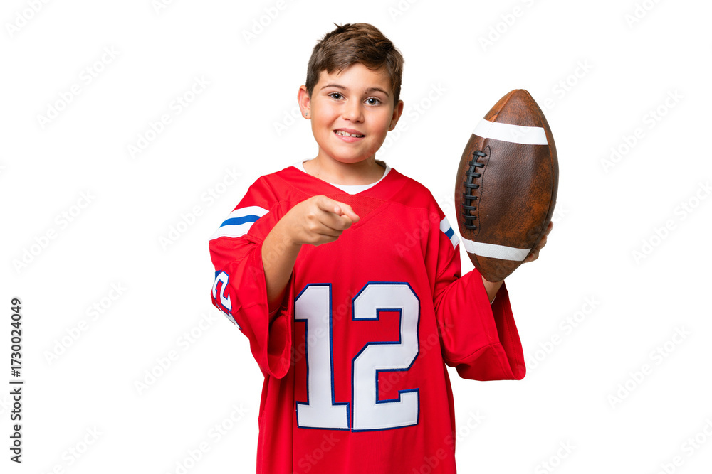 Little caucasian kid playing rugby over isolated chroma key background ...