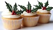 © Arnon  Parnnao - Christmas Cupcake Holly Decoration. Festive confectionery adornment crafting delightful edible embellishment using verdant leaf sprig a charming culinary project for yuletide baking