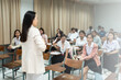 © EduLife Photos - Teacher Giving Lecture to Students in Classroom