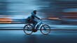 © Manon - A cyclist rides swiftly on an electric bike, captured in motion against a blurred urban backdrop, emphasizing speed and energy.