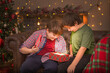 © Надежда Д - The boys open a Christmas gift. A magical light comes out of the box.