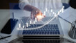 © InfiniteFlow - A businessperson examines financial data on a laptop screen, highlighting graph trends and digital analytics in a modern workspace, illustrating growth opportunities. Impute