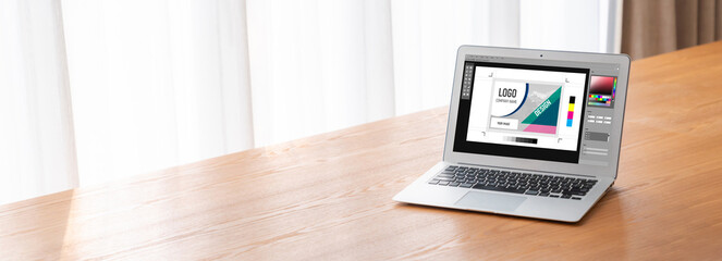 Graphic designer software for modern design of web page and commercial ads showing on the computer screen