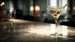 © sornram - A stylish martini glass with olives on a marble bar, exemplifying elegance and taste.