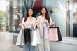 © wichayada - Black Friday shopping adventure: Friends with bags and smiles
