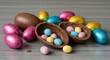 © Kapten - Easter chocolate eggs composition colorful foil wrapped and hollow treats
