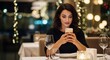 © SSTC AI Photo&Video - Elegant Solo Moment: A woman, immersed in a world of digital connection, sits alone in a beautifully lit restaurant, enjoying a moment of quiet reflection while engaging with her smartphone.