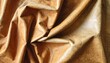 © Apel - Soft, tan leather draped in folds