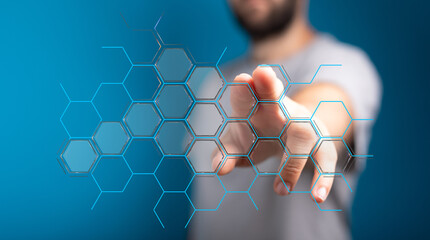 Abstract image of a hand interacting with a digital hexagon network.  Perfect for tech, innovation, and connection concepts.