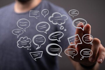 person interacts with digital speech bubbles, symbolizing connection, communication, and modern soci