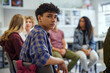 © Rido - Hispanic student guy in support group discussion at school