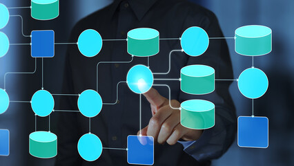 Data flow diagram. Developer analyzing and optimizing data processing system. Man processing data using the program.