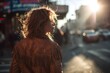 Fringe leather jacket worn by confident woman striding through vibrant sunlit urban city street.