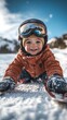 © COK House - A cheerful child in an orange winter jacket and goggles skiing in the snow.Ideal for advertising winter vacations, children's sports camps, family trips, and active lifestyles.