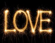 © laya - Sparkler-drawn word LOVE on black background