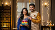 © Niks Ads - Indian couple in blue and gold festive attire stands together in a warmly lit, decorated room, holding colorful gift boxes and surrounded festive lights.