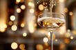 © dashtik - Sparkling champagne pour in elegant glass with bokeh lights