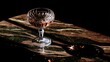 © Zhou - refraction. Crystal wineglass with red liquid, dramatic backlight creating refraction, dark marble surface. bar promotions, beverage menus, designed for food & beverage menus and cafe branding.