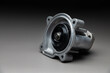 © yanik88 - A new car part on a gradient gray background. Close-up of a new internal combustion engine coolant pump. Contrast backlighting.