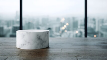 Wall Mural - A white marble cylinder podium rests on a wooden table set against a blurred urban cityscape viewed through a large window