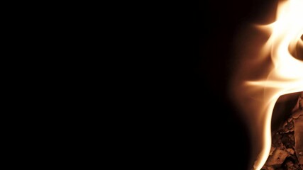 Burning paper, glowing edge of paper on a black background. Mockup for your logo. Wide angle horizontal wallpaper or web banner. flame effects for overlay designs or screen blending mode to make high.