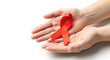 © Felipe - A pair of hands gently holding a red ribbon, symbolizing awareness and support for those affected by the disease. It's a gesture of hope and solidarity