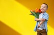 © BillionPhotos.com - Child with beautiful bouquet of tulips. Women's Day.