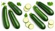 © Malika - An overhead shot of several fresh green zucchini, whole and sliced, with parsley leaves arranged
