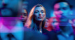 © Parisa - Confident businesswoman in focus as crowd blurs in blue and magenta lighting