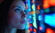 © Anisah - Young woman analyzing colorful illuminated digital data visualization with futuristic technology and artificial intelligence concept in dark room