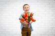 © BillionPhotos.com - Child with beautiful bouquet of tulips. Women's Day.