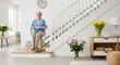 © Bhavesh - Smiling senior woman using modern stair lift in bright home interior, symbolizing elderly independence, accessibility, mobility support, and safe living solutions