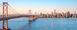 The skyline of san francisco and the oakland bay bridge during sunrise