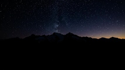 Wall Mural - seamless aerial timelapse transition from bright day to a mesmerizing starry night sky over a sprawl