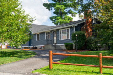 Wall Mural - residential building exterior with wooden fence